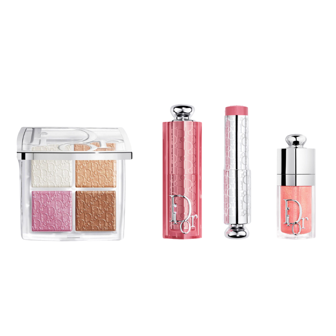 A luxury Dior makeup set featuring a four-shade eyeshadow palette, a pink quilted lipstick case, a lip gloss, and a matching pink lipstick.
