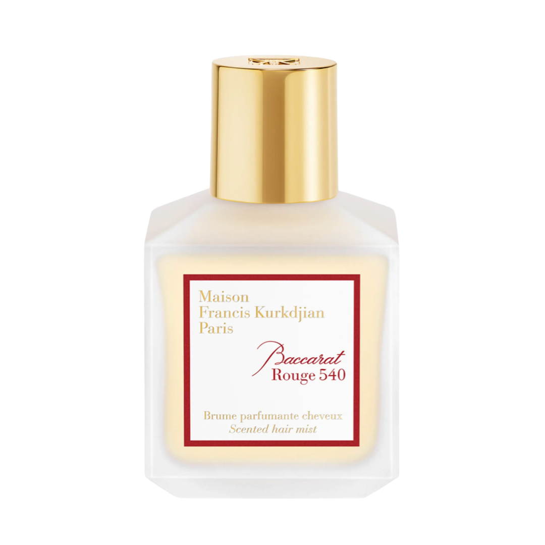 A frosted glass bottle of Maison Francis Kurkdjian Baccarat Rouge 540 hair mist with a polished gold cap.