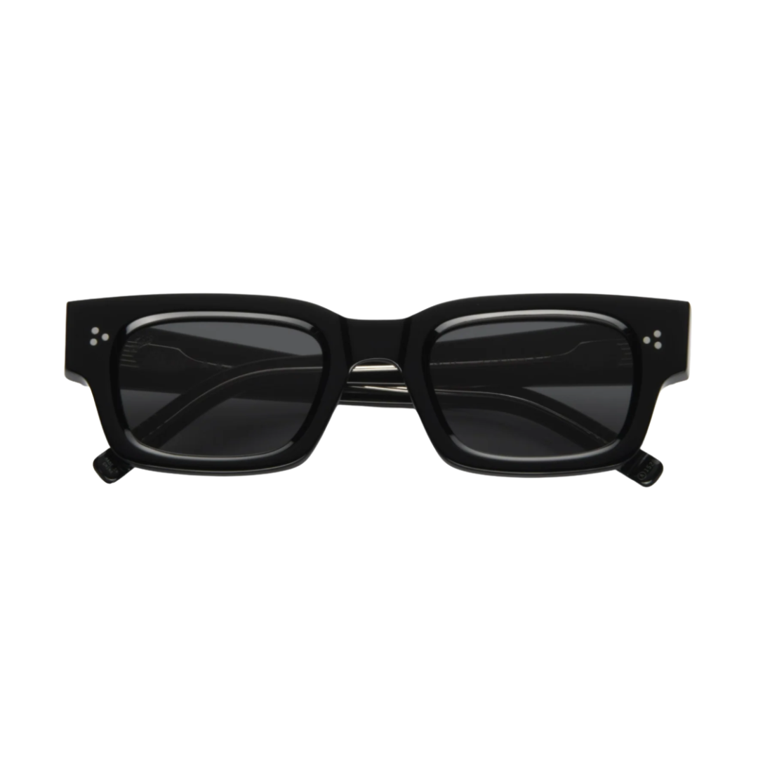 A pair of thick-framed black acetate rectangular sunglasses with dark lenses.