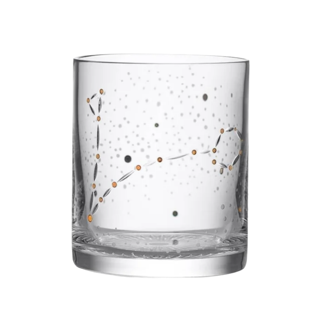 A crystal Waterford glass tumbler featuring an etched Pisces constellation with gold and silver celestial stars