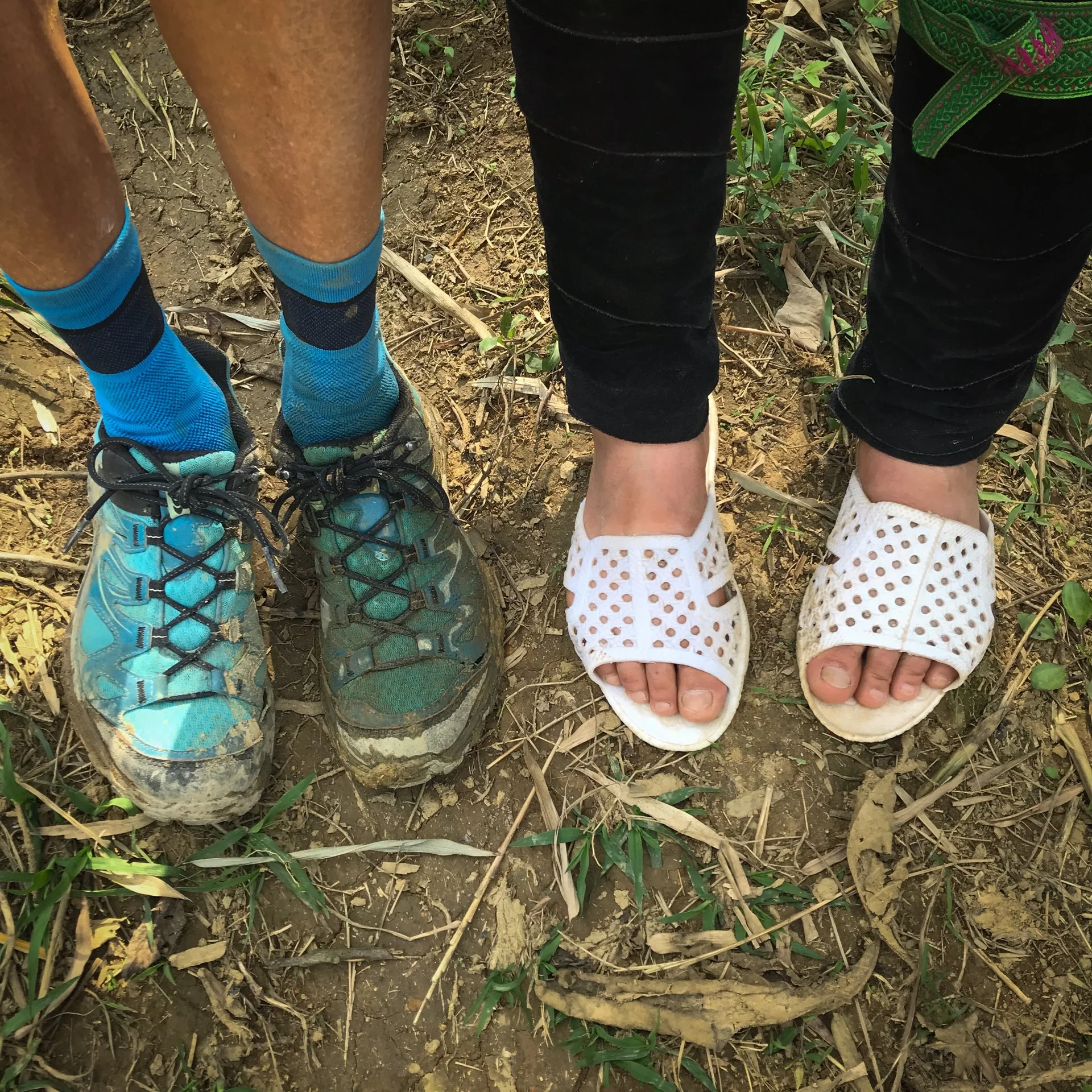 Pearl's and Ying's feet after a day of walking in the mud.