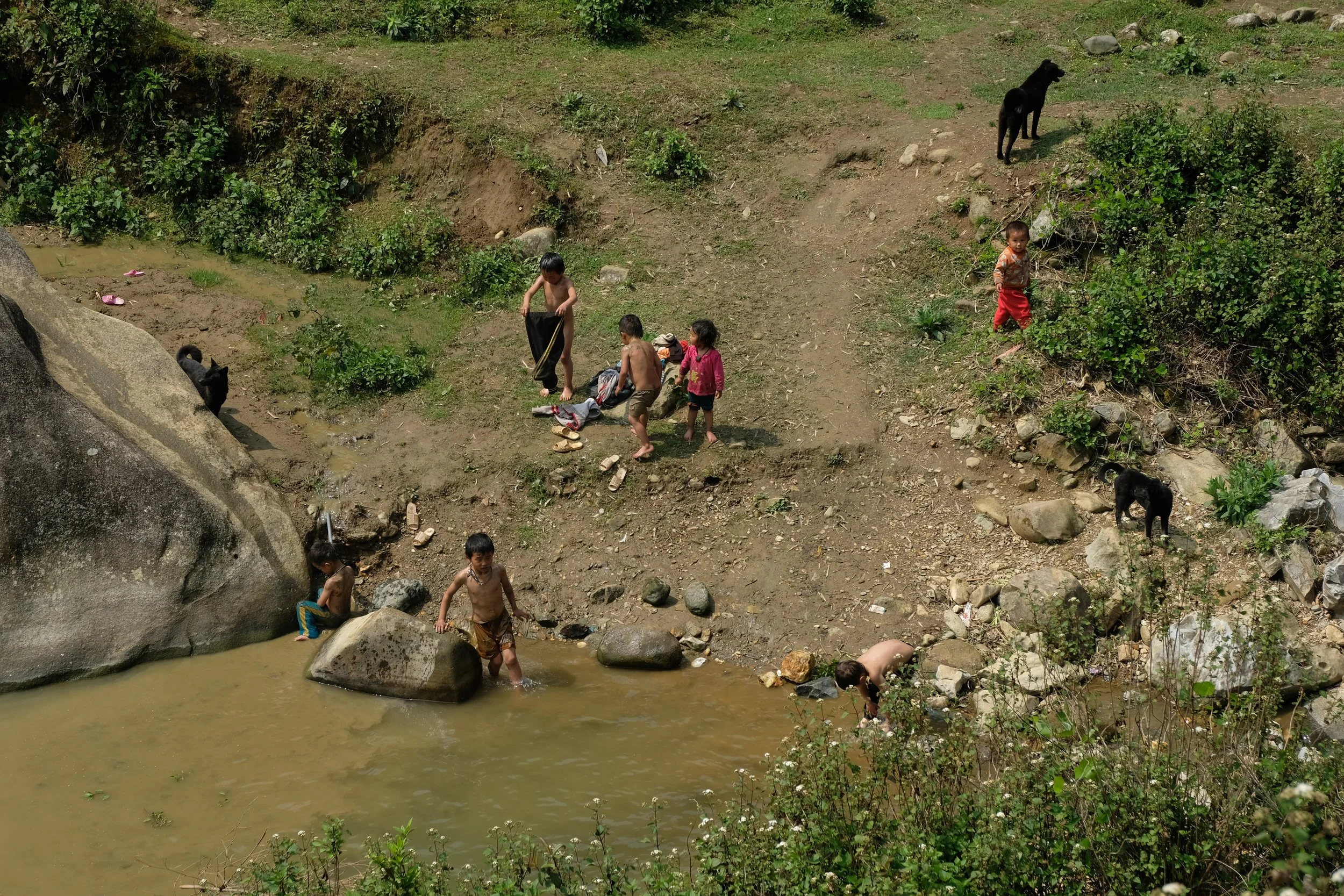 Kids playing in local streams