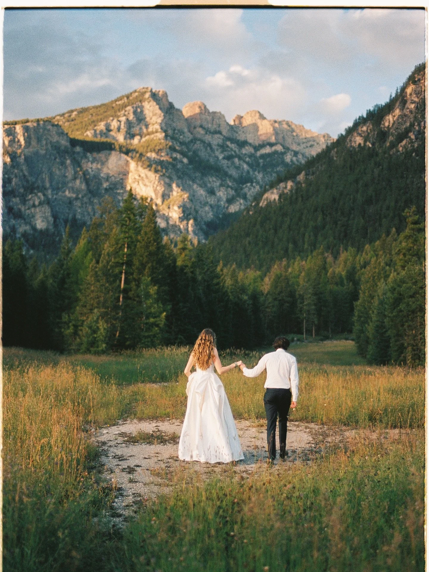 Nathalie &amp; Darragh frolicking below the majestic Fairmont Ridge 🏔️ at sunset on their wedding day - could it get any sweeter? 🎿🌞🍄 on film of course 🎞️