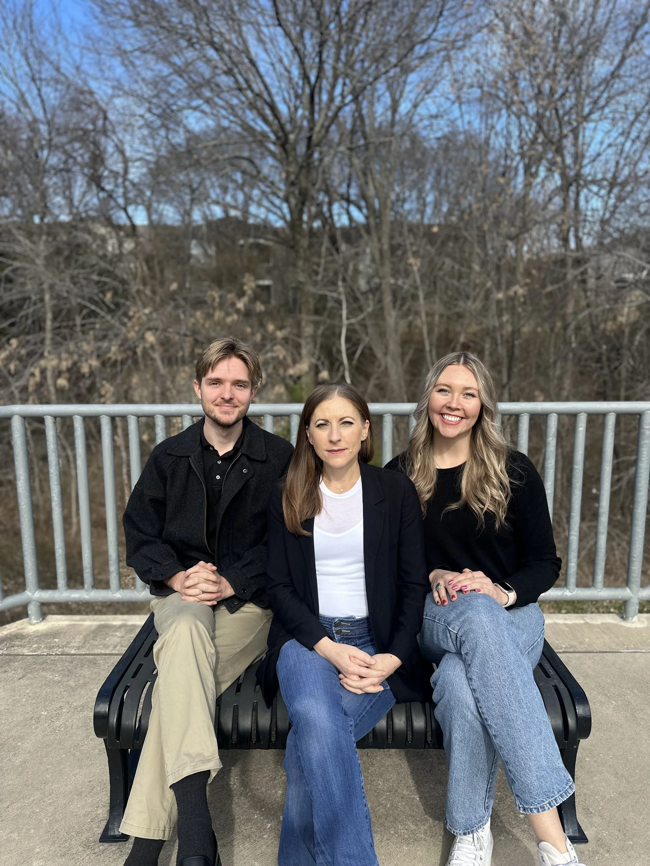 3 Therapists sitting on a bench outside