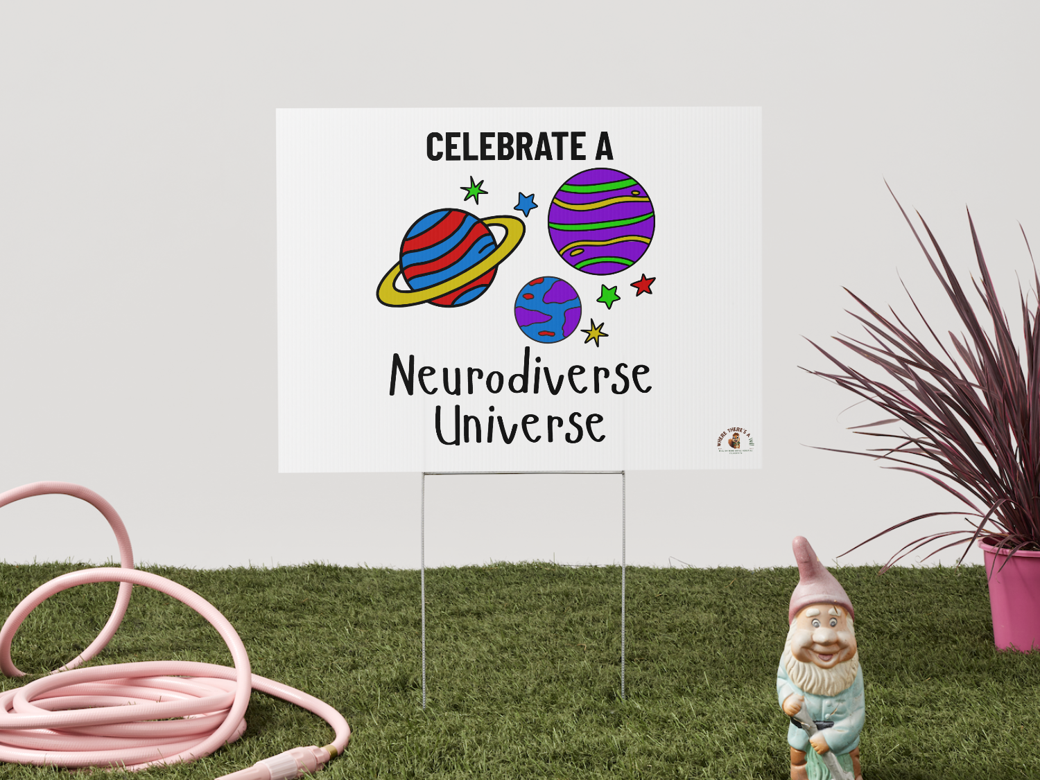 yard sign with colorful planets reading celebrate a neurodiverse universe