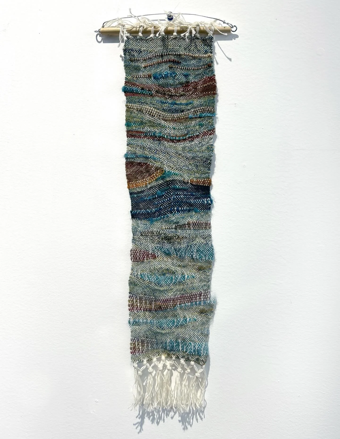 &lsquo;Ebb Tied&rsquo; 
finished Jan 2025 on my Schacht Cricket loom, made with leftover handspun and scraps of roving + other yarns; finally hung it last week 😅