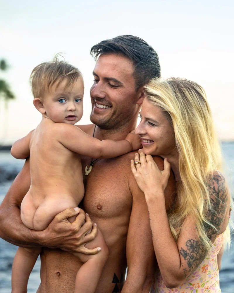 parents looking at their baby boy 