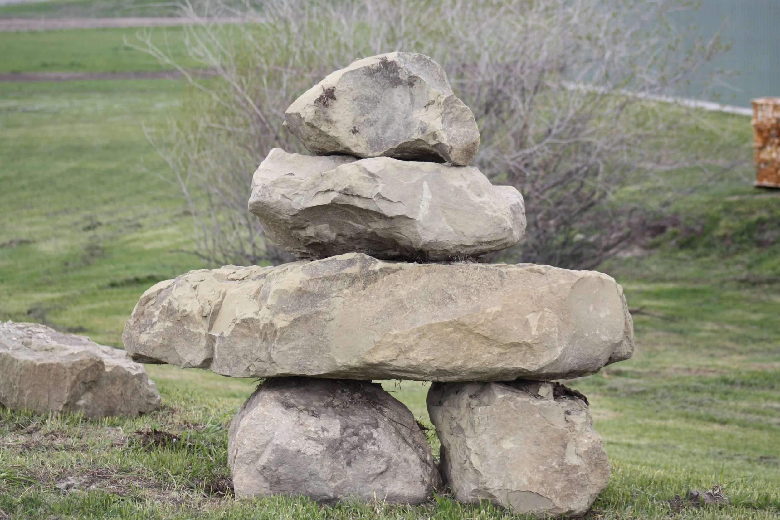 Landscaped rock grouping in the shape of an inukshuk