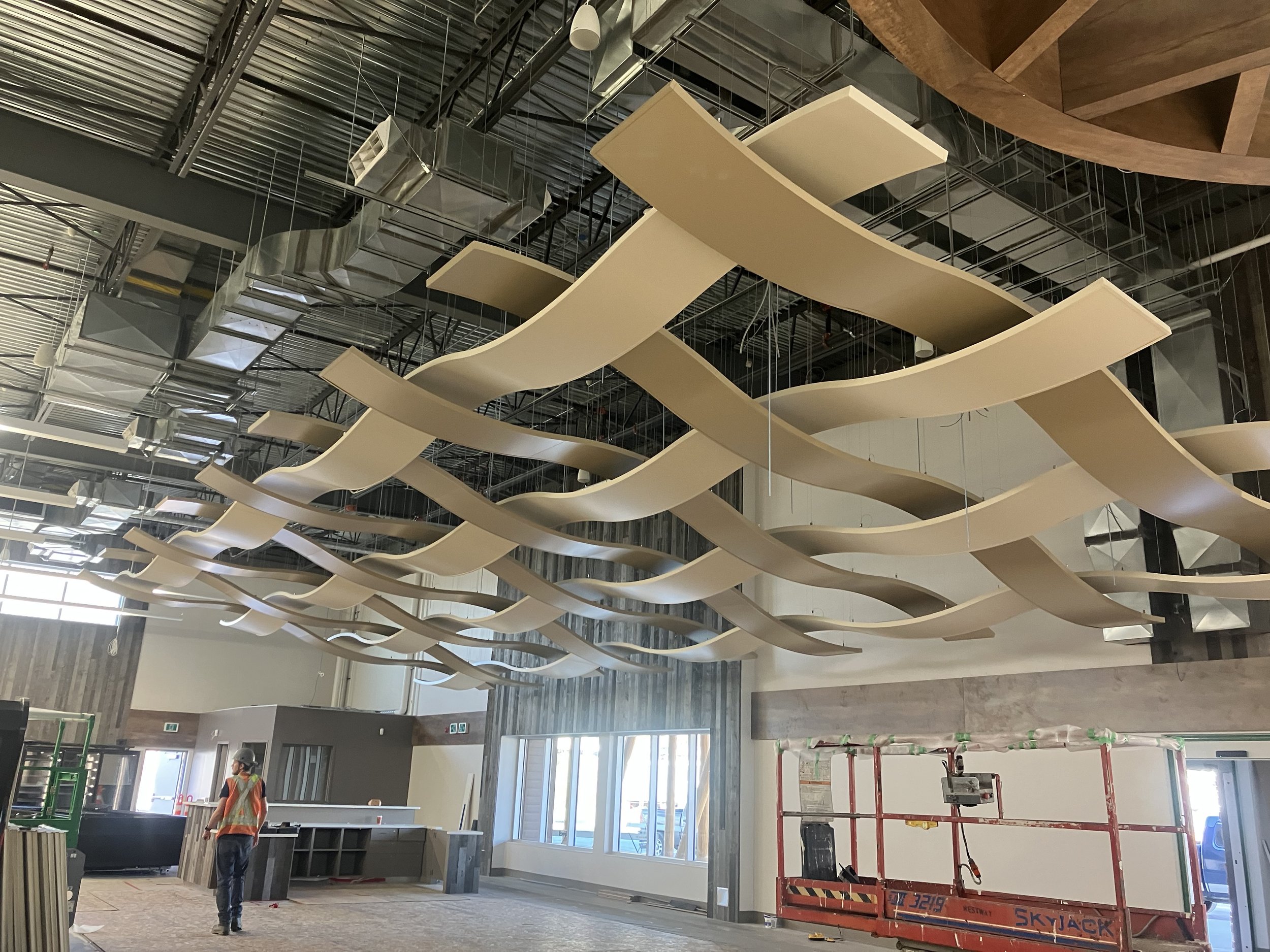Sweláps Market, working on Armstrong Serpentina ceiling tile installation