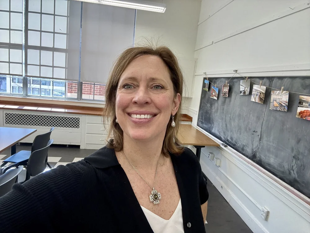 Kristi Leonard smiling in a classroom