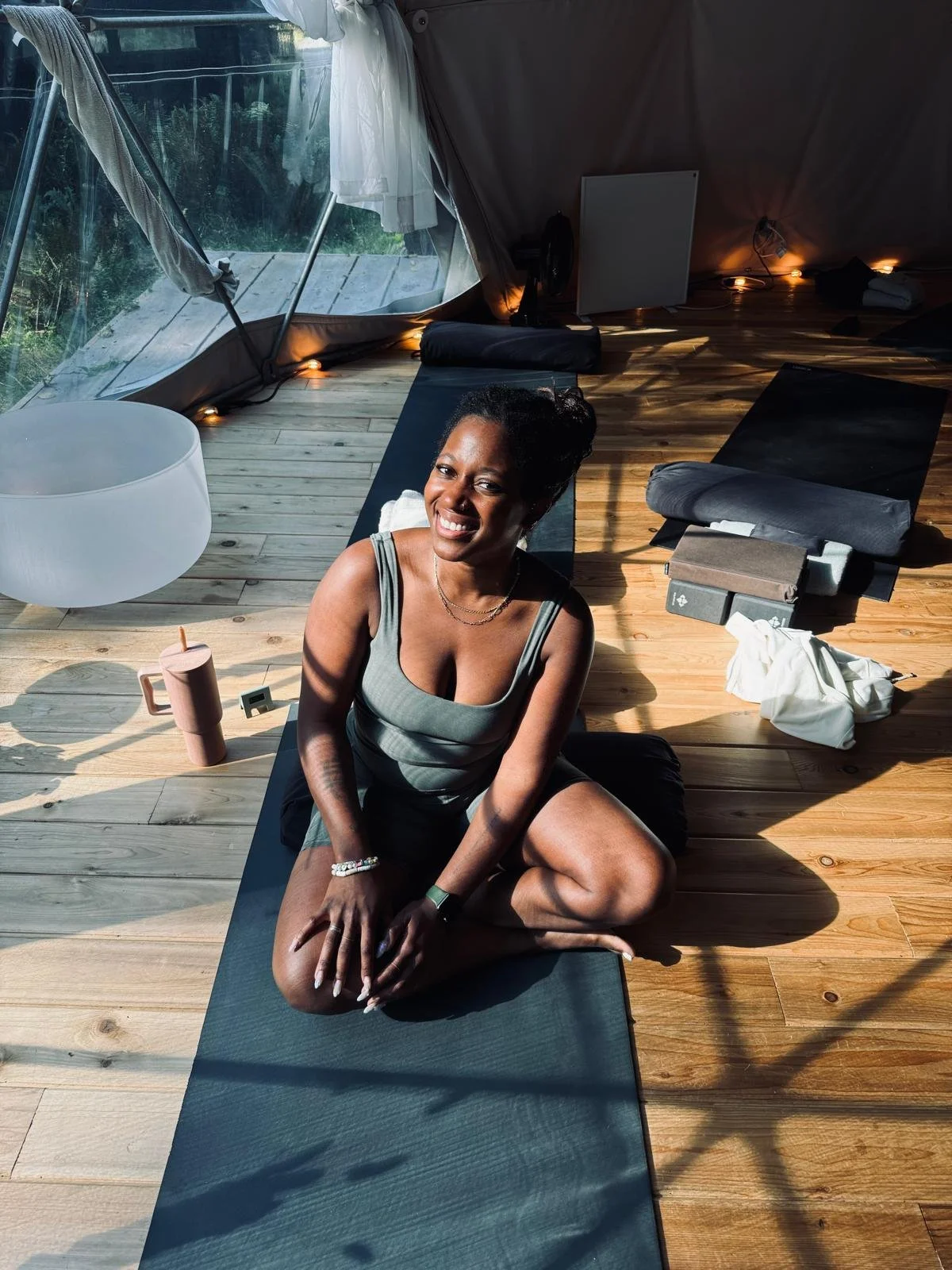 african american and latin yoga teacher on yoga mat