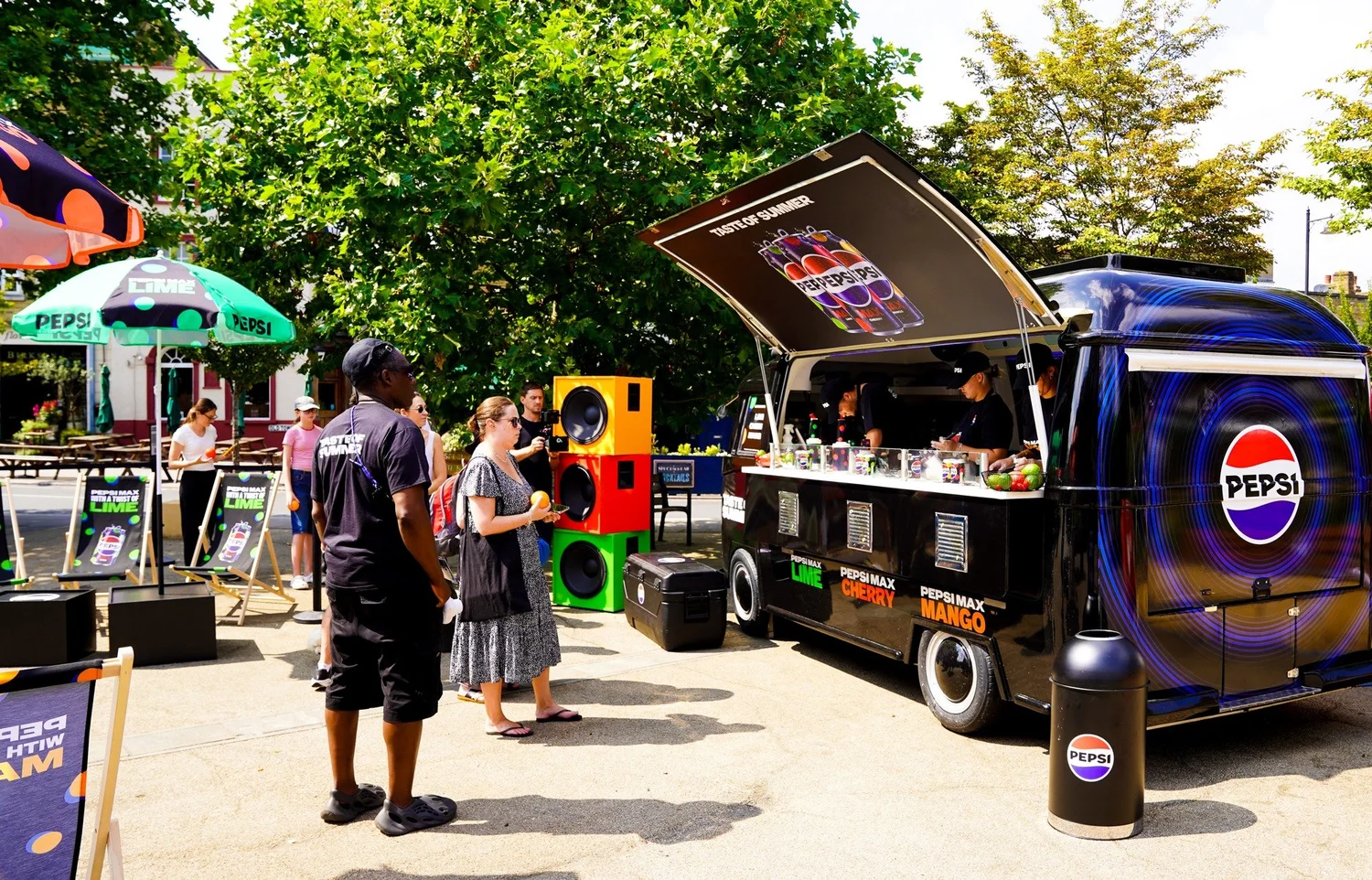 Pepsi branded VW-style promotional truck serving guests at an outdoor activation
