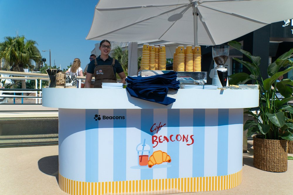 Beacons AI striped coffee counter and barista at Cannes Lions