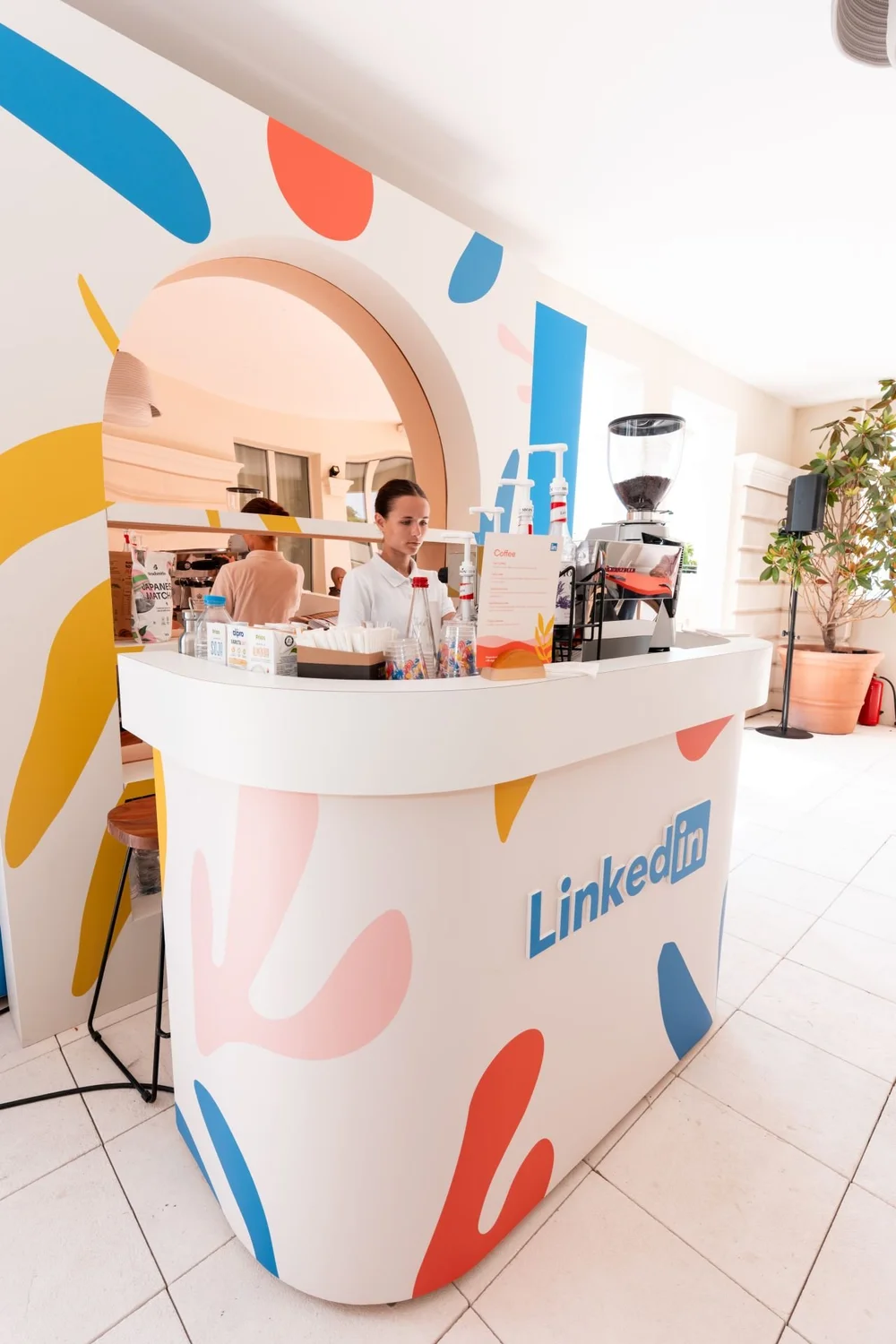 LinkedIn branded coffee counter with baristas at Cannes Lions