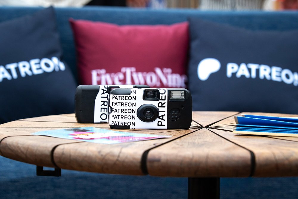Branded Patreon disposable camera with cushions at Creator Brand Space