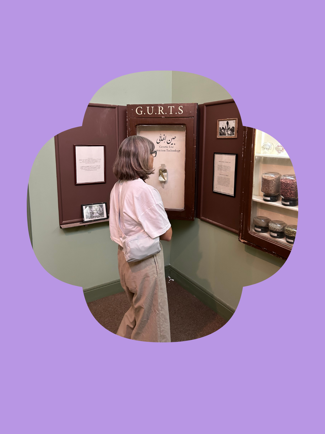 A member of The Nadi viewing an exhibit at a museum display.