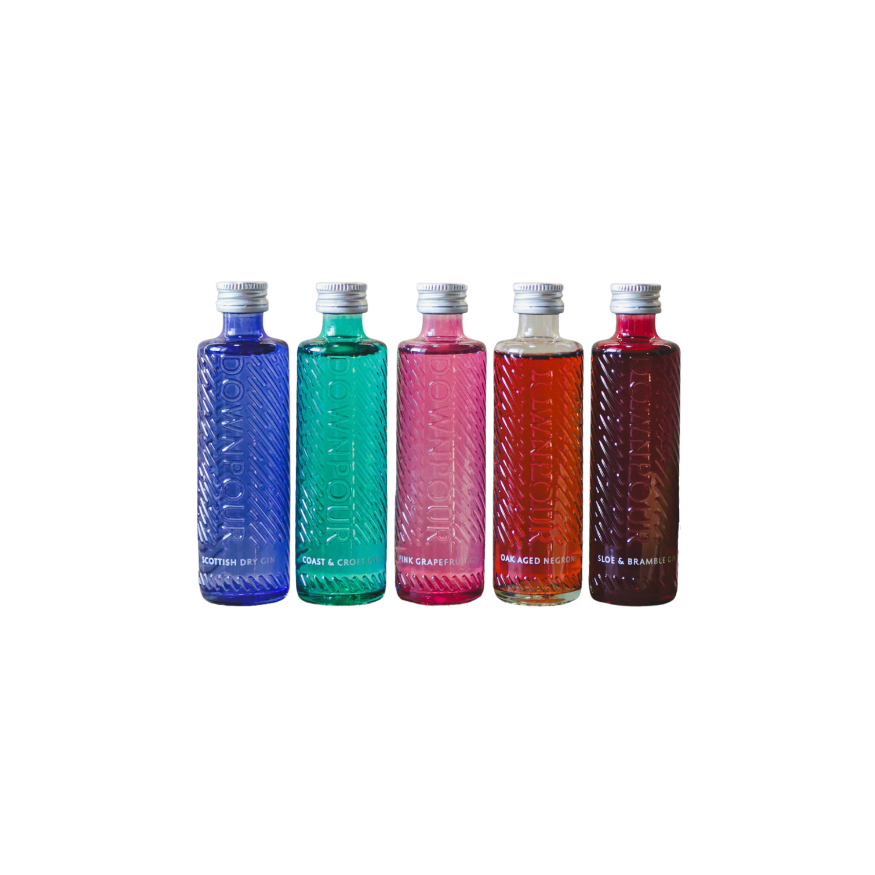 Five colorful bottles arranged in a row, each with a metallic cap and embossed text on the surface, containing different flavors of beverages.