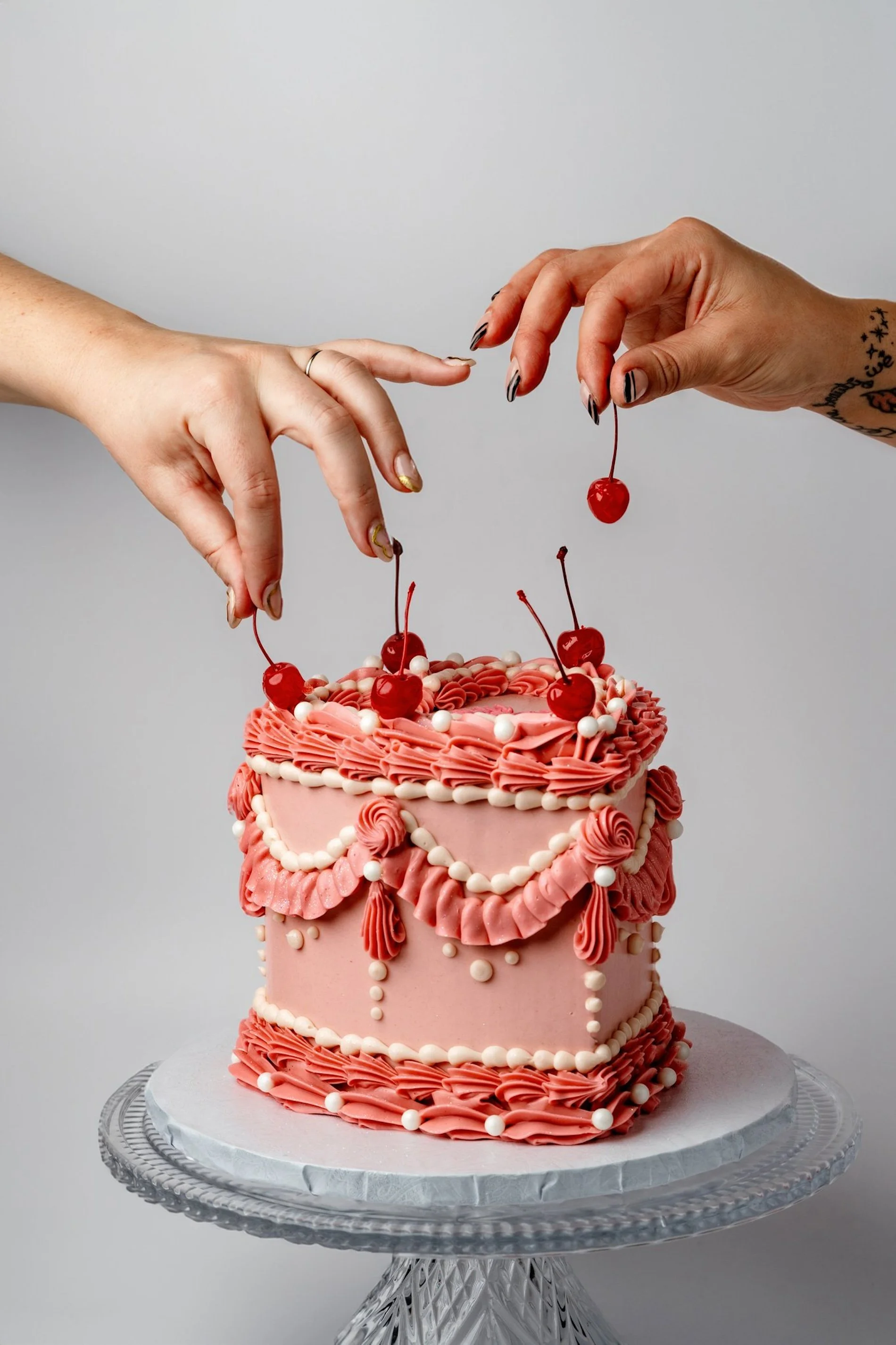 ECBG cake studio heart shaped pink cake with cherries on it