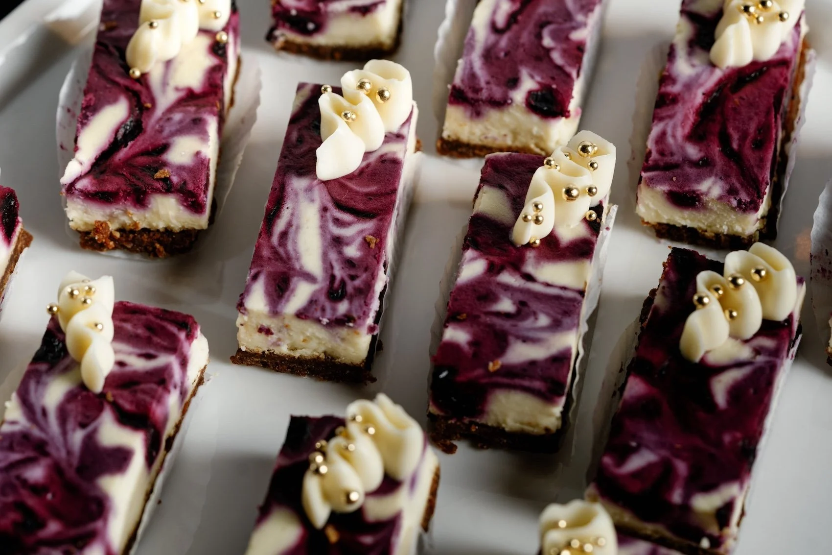Individual slices of blueberry goat cheese cheesecake