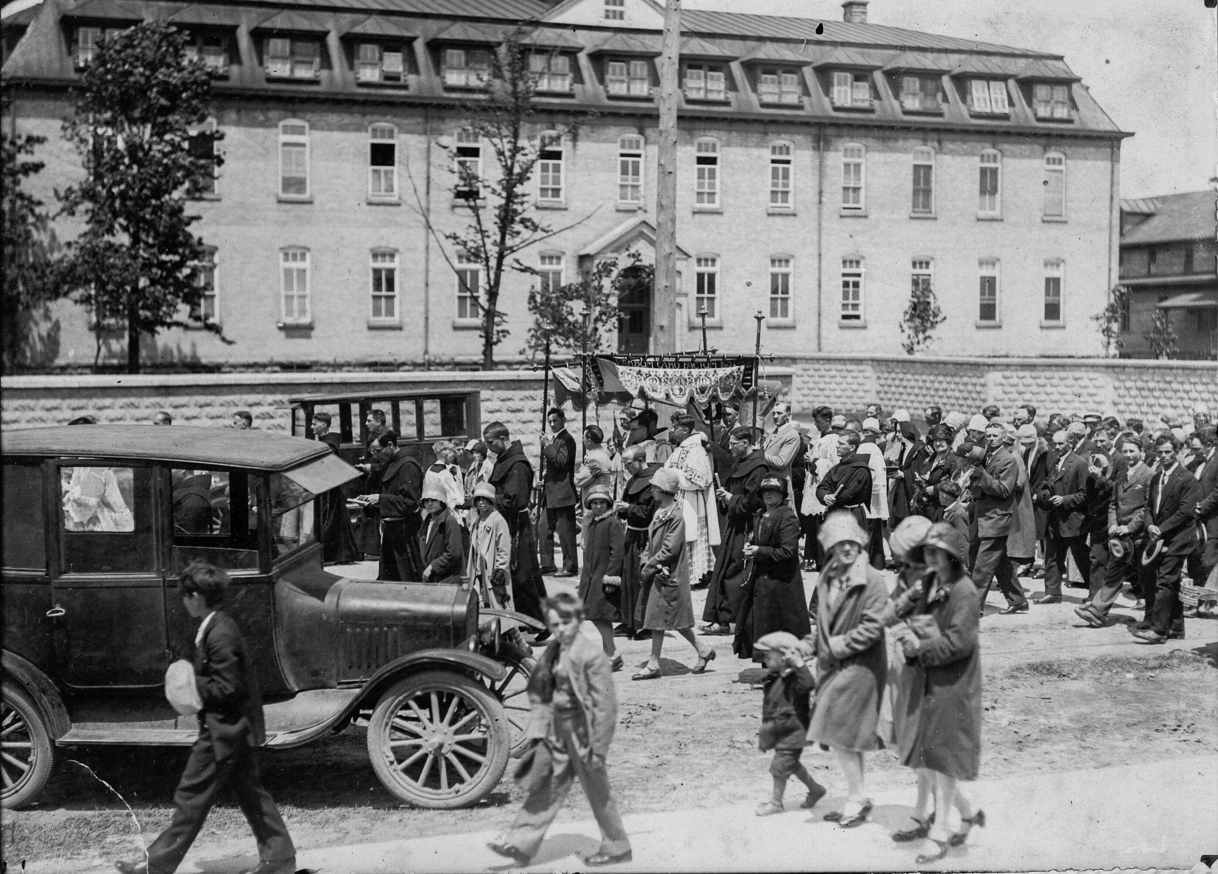 c1925 ABVM Procession with car in foreground.JPG