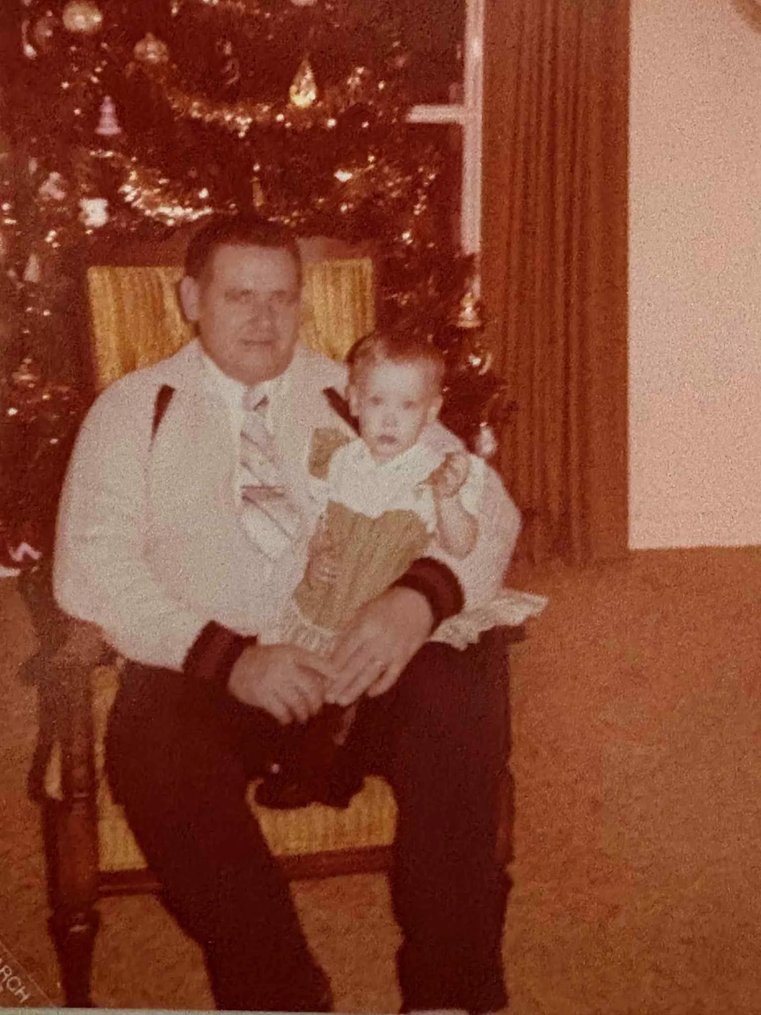 Ted Brewczynski and daughter, Tracey (Karcz) posing nicely in front of the family tree.