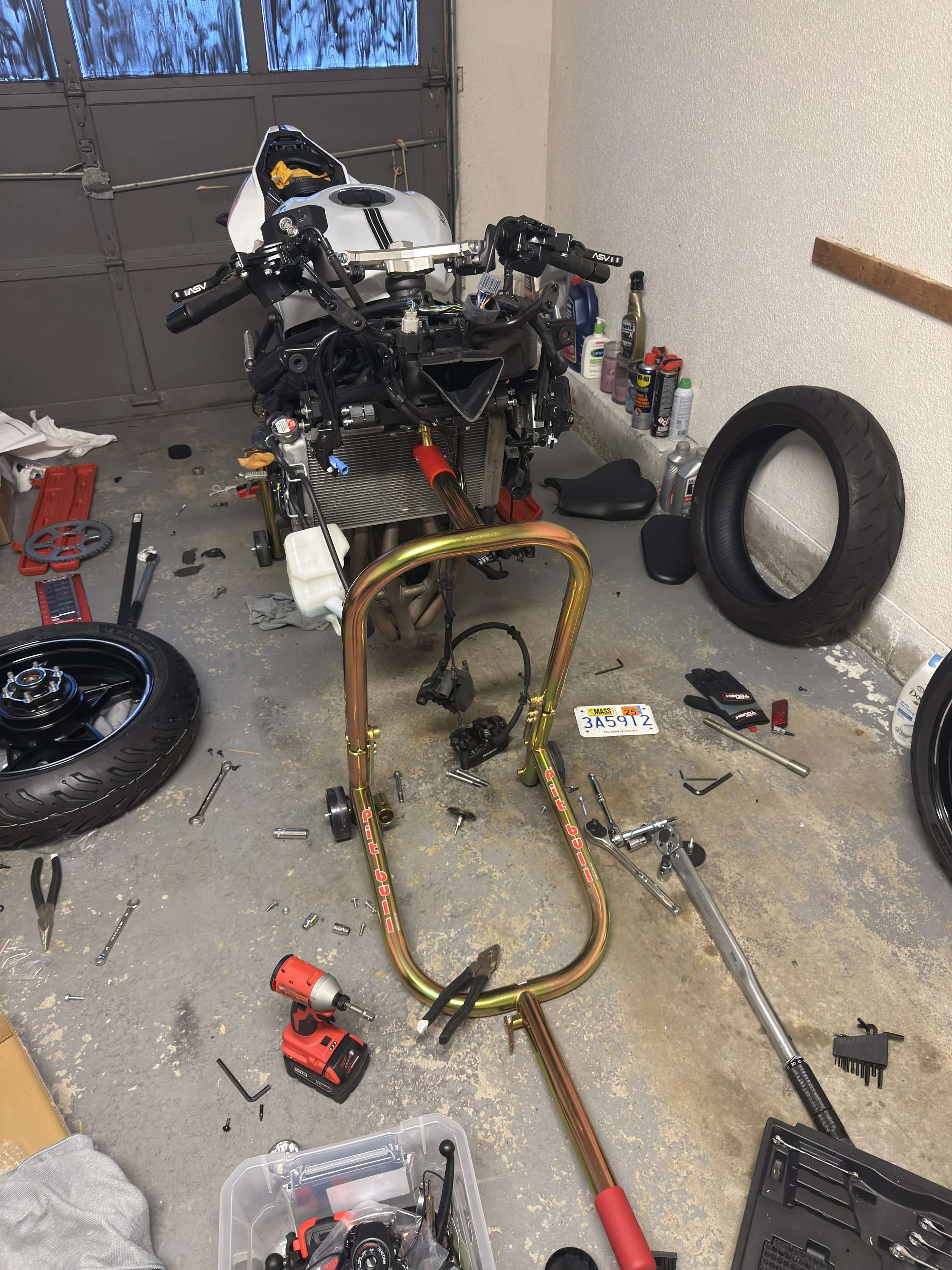 Front end stripped. My ZX4 with the front wheel, forks and main fairings removed. August 9, 2025.