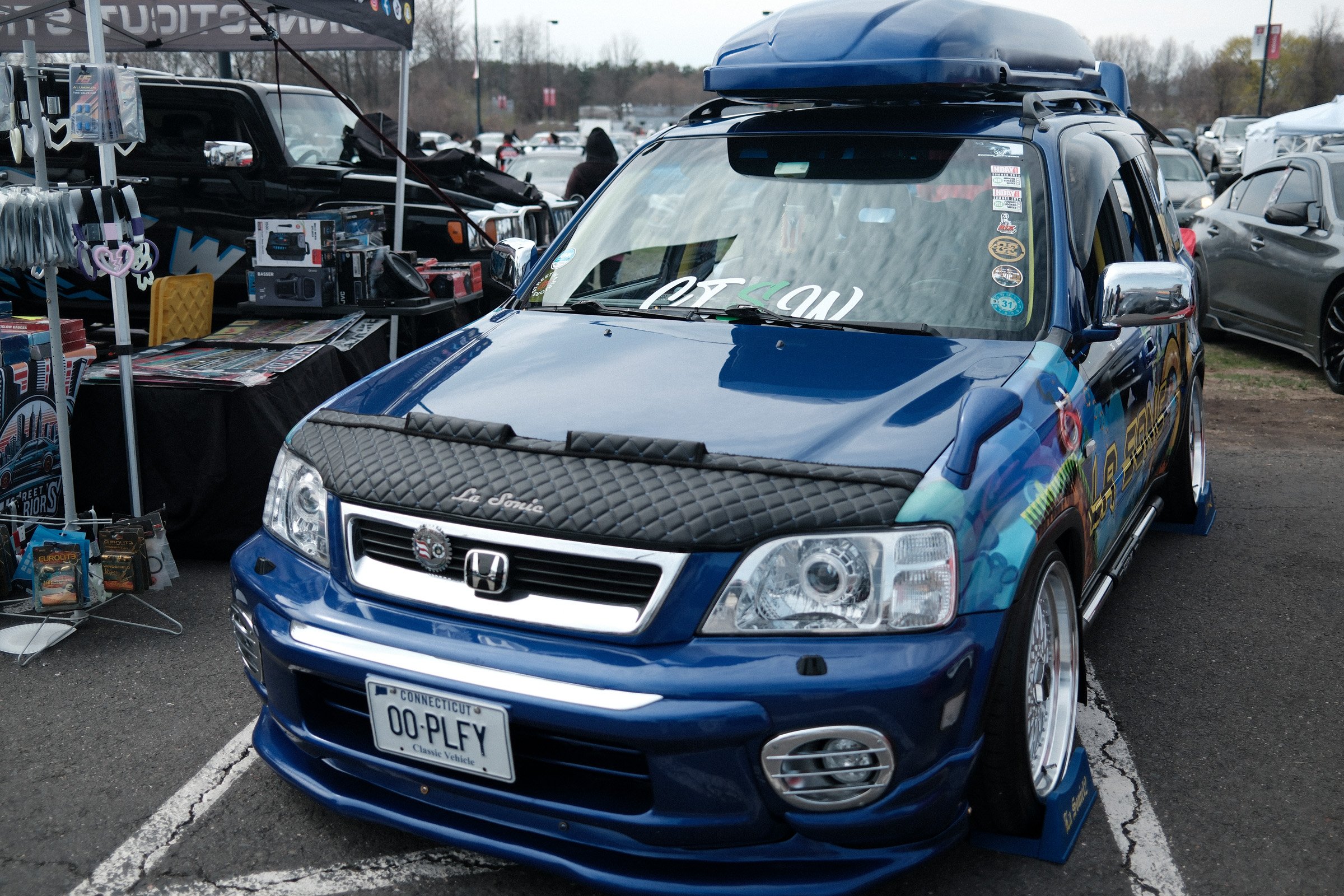 Built in Blue — A customized blue Honda SUV at an outdoor car gathering.