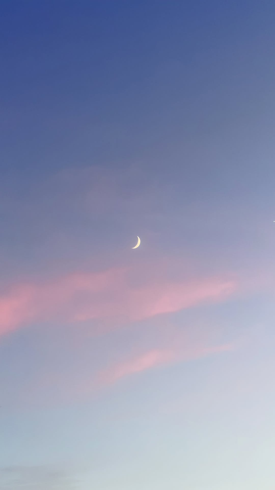 Rose Hour — A crescent moon hangs above soft pink clouds in a lavender evening sky.