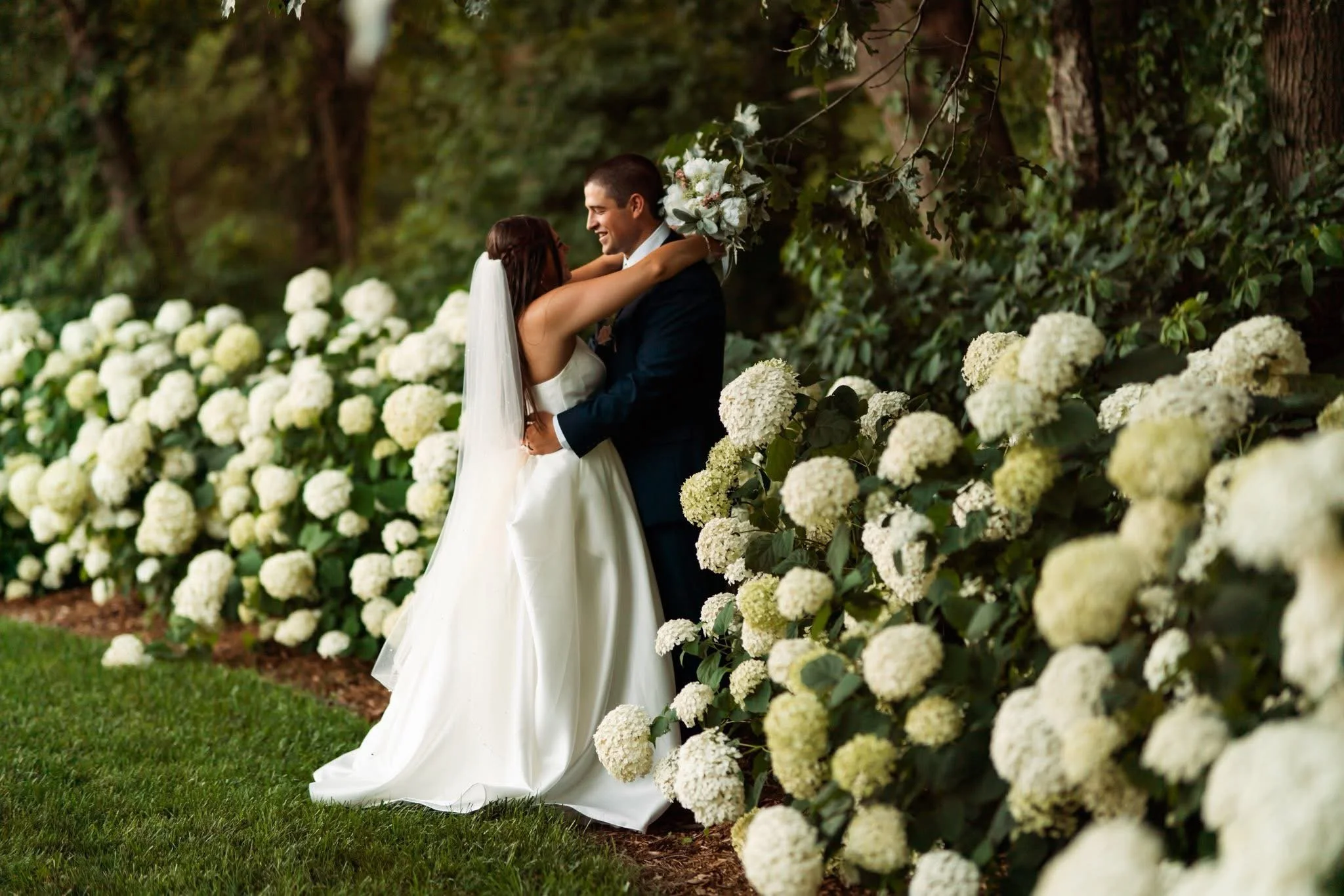 Another moment for these STUNNING hydrangeas and the beautiful bride and groom (and doggo). Soft blooms and lush greens. A setting that truly speaks for itself. 🤍✨ Twin Gables Event Center creates a timeless, romantic atmosphere that elevates every 