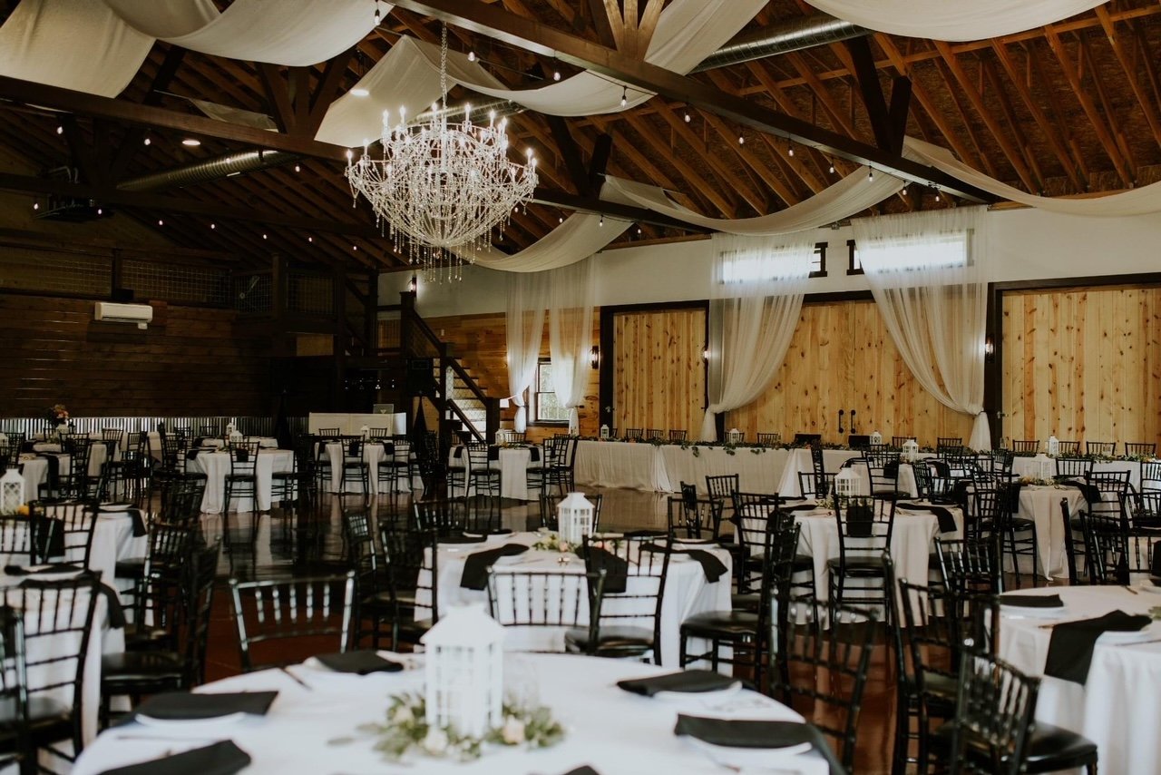 rustic wedding reception inside barn