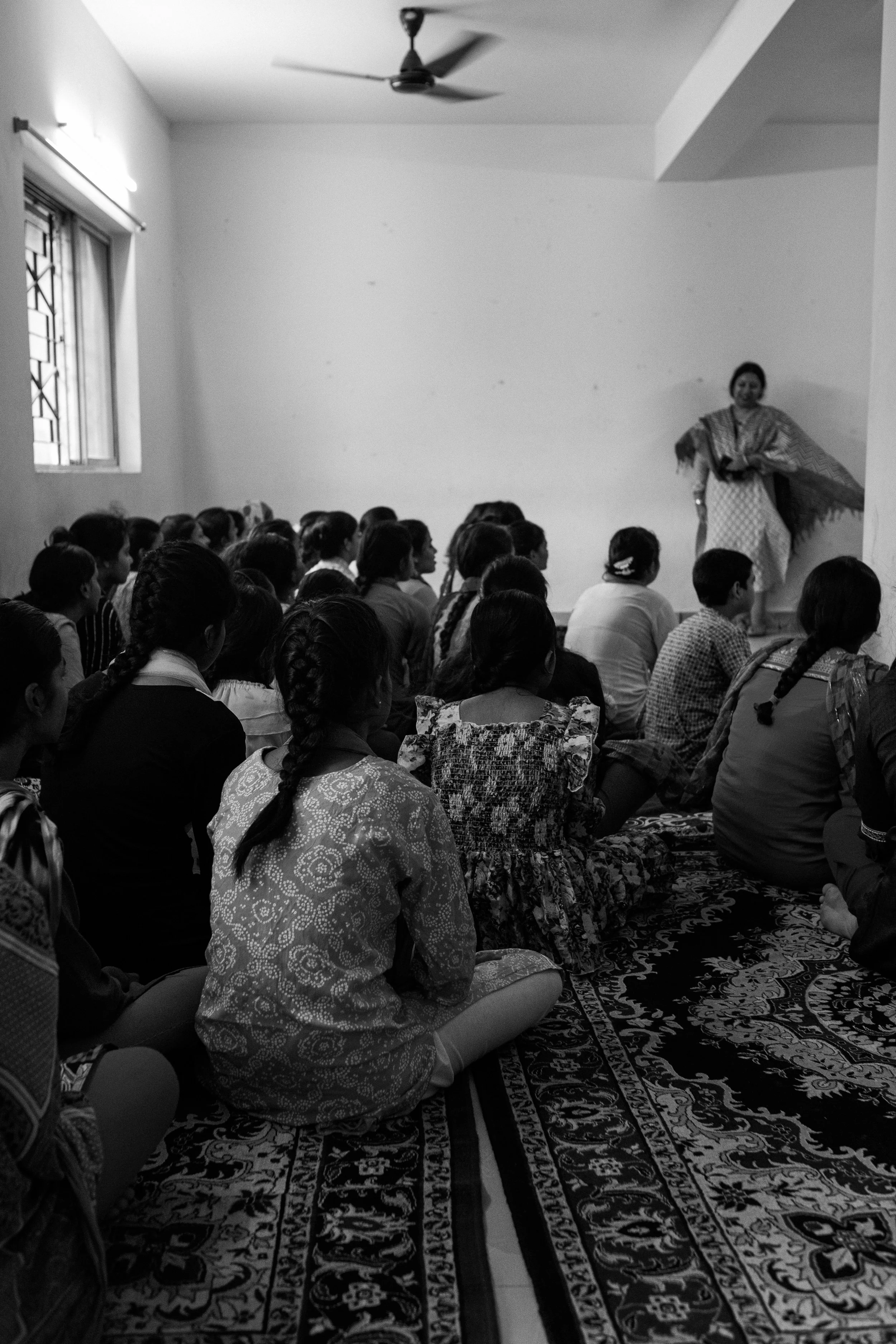 Children participating in a group learning and counseling session that supports healing, education, and protection from exploitation in Kolkata, India.