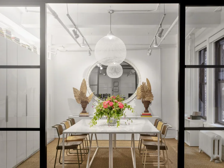 Dining and meeting space with track lights (Young Huh’s Studio): Lutron smart lighting with pendants and track spotlights