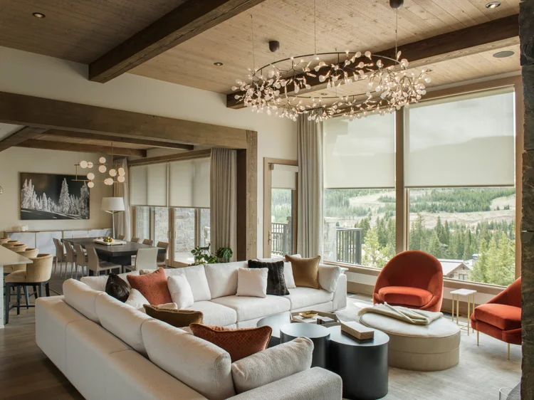 Mountain-modern living and dining room: Lutron QS shades and layered lighting on HomeWorks QSX