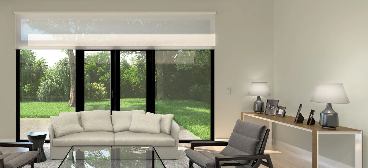 Living room with shades partly open above a sliding door wall