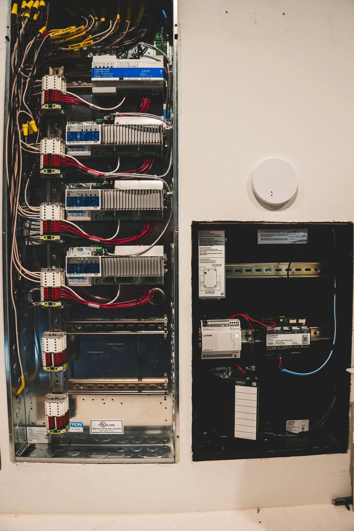 Lighting control panel with modules mounted in rows and dressed wiring