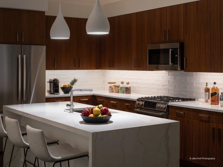 Kitchen with island pendants: layered Lutron lighting and Ketra S30 lamps