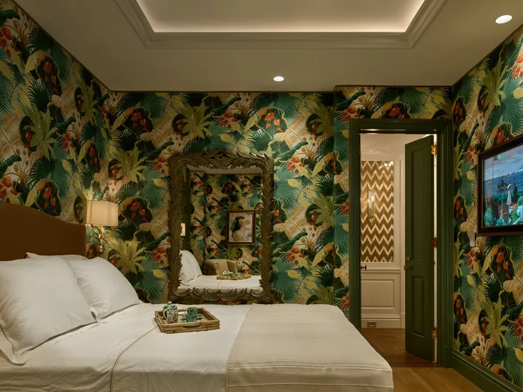 Bedroom with linear lighting and bold wallpaper (Ritz Tower Residence, New York, NY): Lumaris linear lighting and HomeWorks QSX control