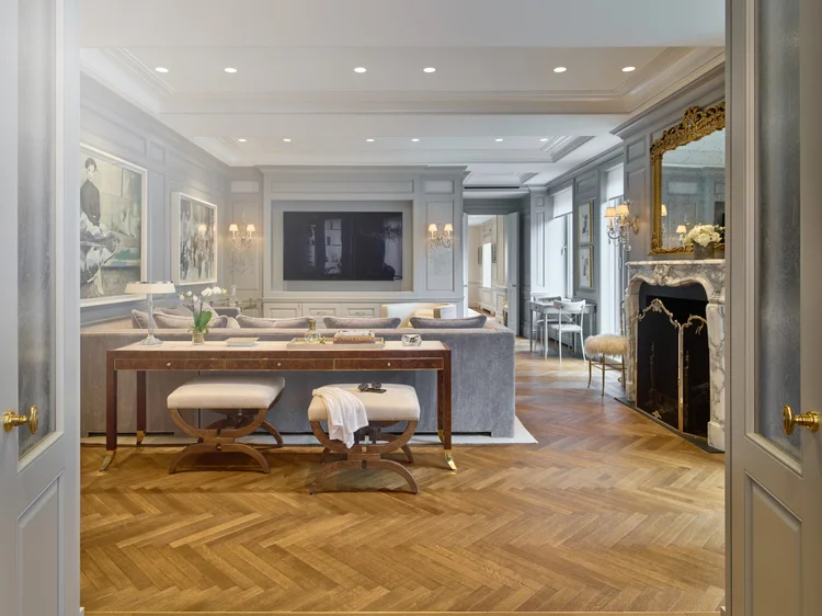 Traditional living room with coffered ceiling (Ritz Tower Residence): Lutron recessed lighting, sconces and motorized shades