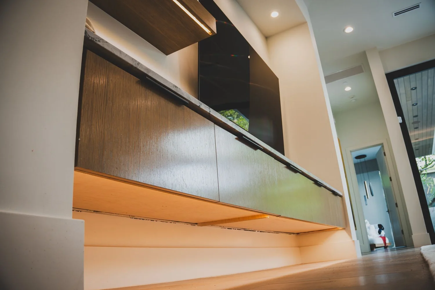 Media wall cabinet with warm underlighting