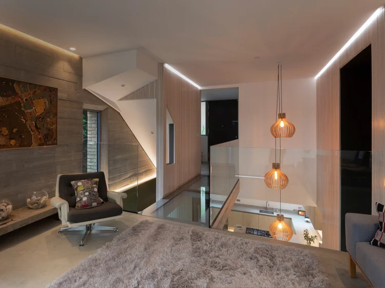 Loft-style living space (Private Residence, Northeast, USA): Lumaris linear lighting, Ketra downlights and HomeWorks QSX