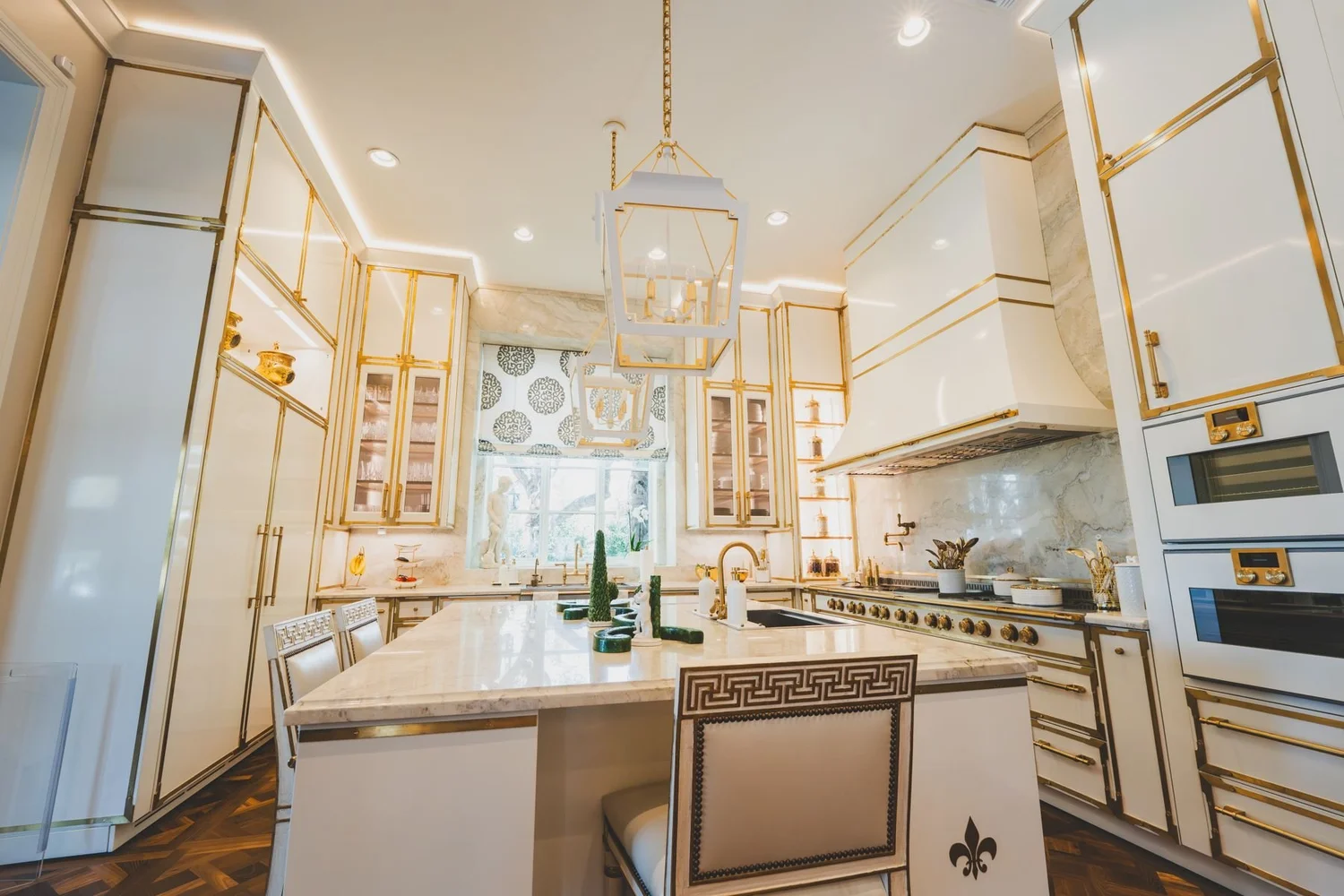 Kitchen with accent lighting along cabinets and a pendant over the island