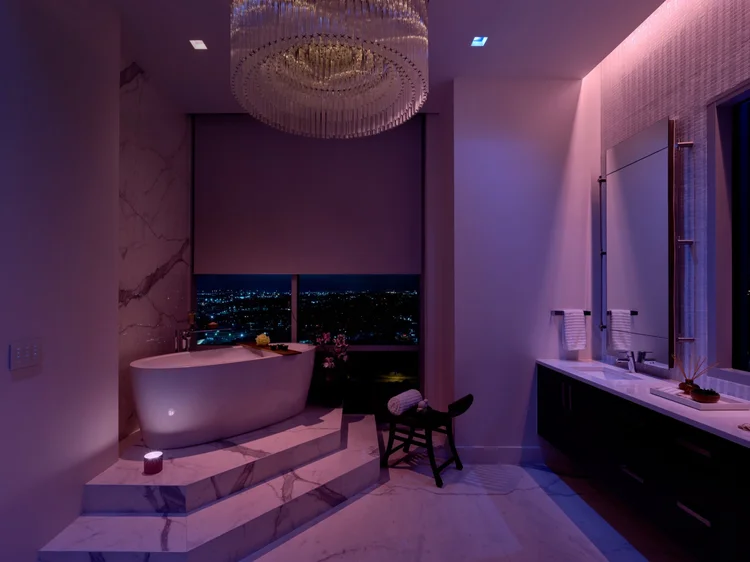 Bathroom with color-tunable light (Seaholm Penthouse, Austin, TX): Lutron smart lighting and motorized roller shades
