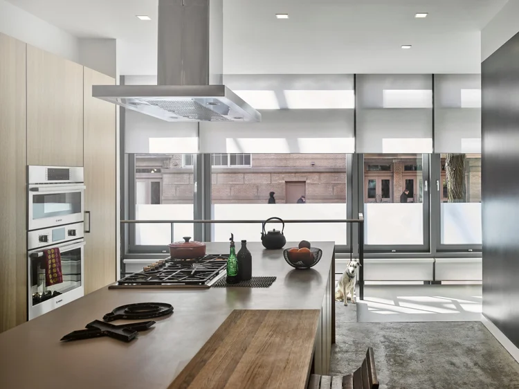 City-view kitchen: Lutron motorized roller shades and Ketra D2 square-trim downlights