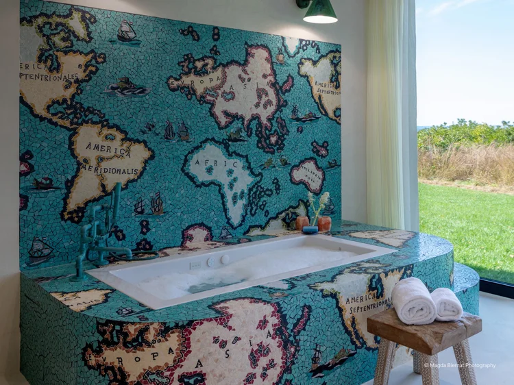Bathroom with mosaic world-map wall (Hamptons Barnhouse, Hamptons, NY): Lutron motorized drapes, Ketra fixtures and HomeWorks QSX