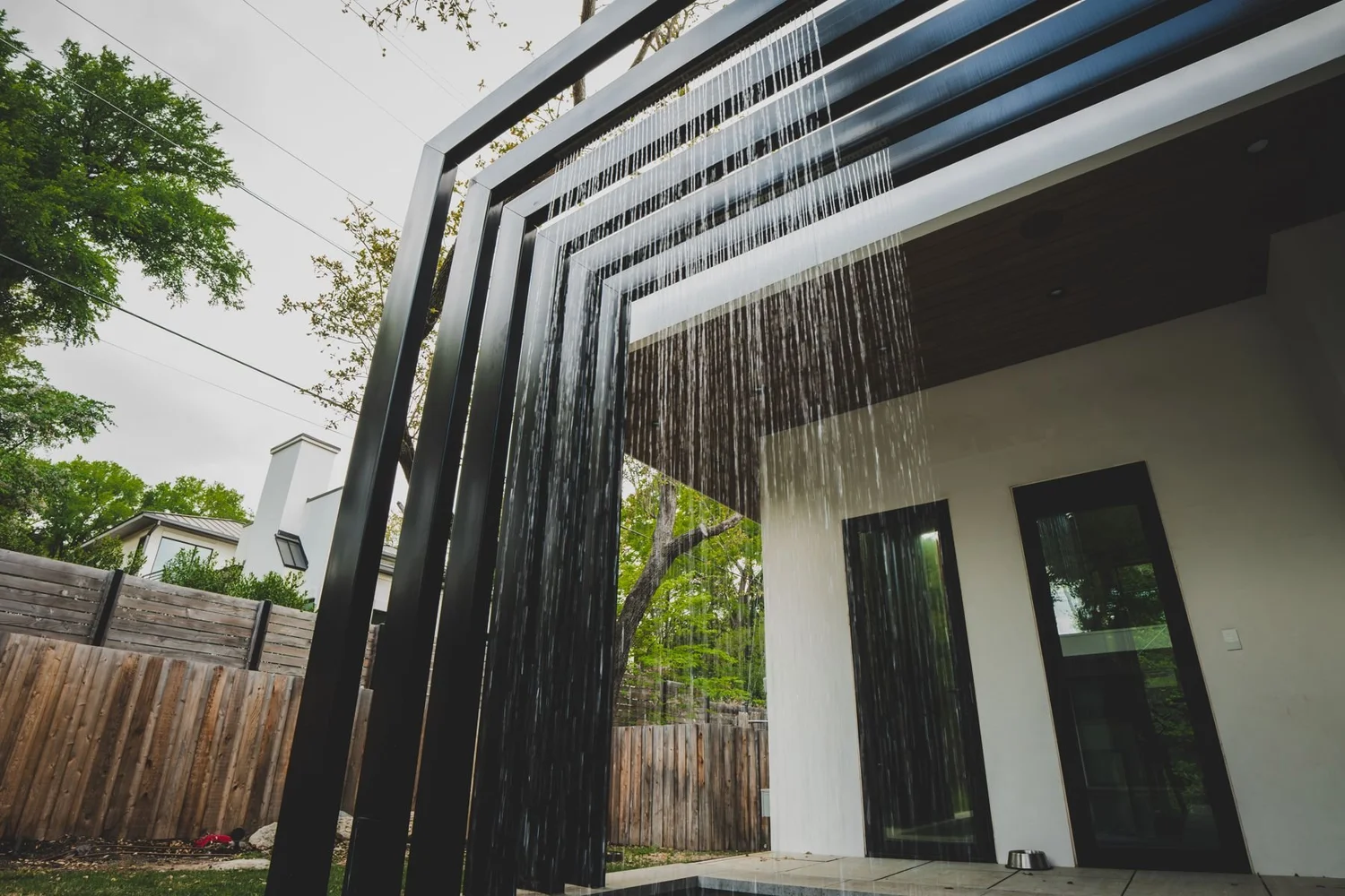 Patio water feature over a plunge pool