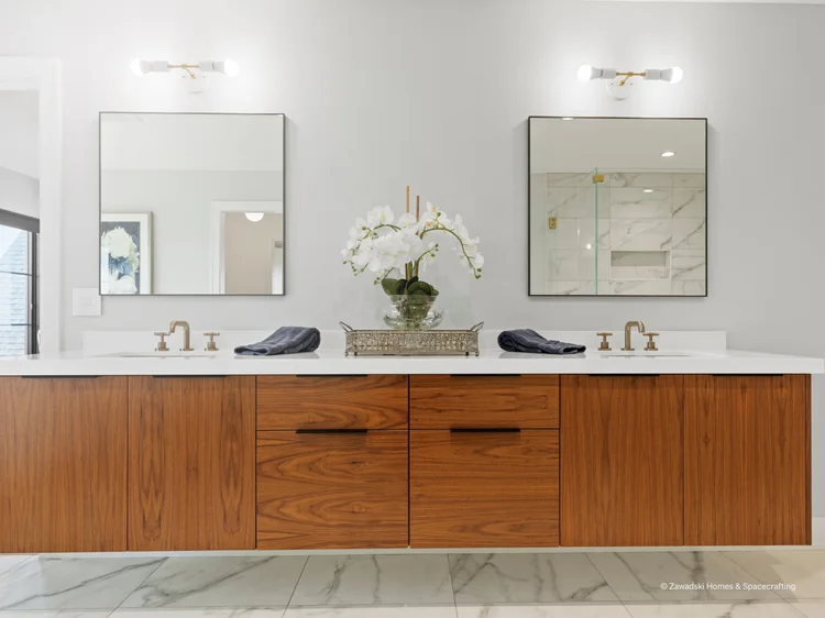 Bathroom vanity with dual mirrors and sconces (Whistling Valley Residence, Lake Elmo, MN): HomeWorks QSX lighting control
