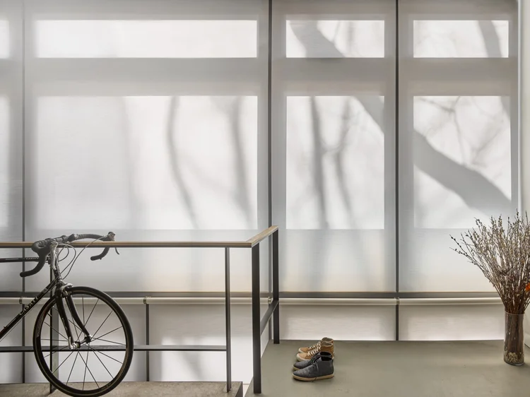 Entryway with roller shades (New York): Lutron motorized roller shades