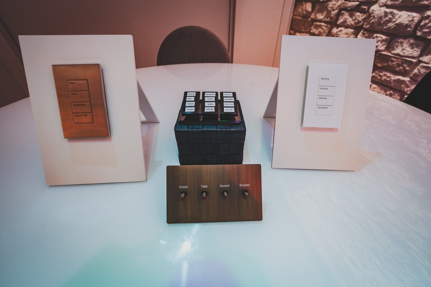 Lutron keypads in several finishes displayed on stands