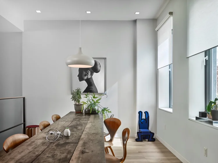 Dining space with pendant light (New York Loft): Lutron recessed LED lighting and motorized roller shades