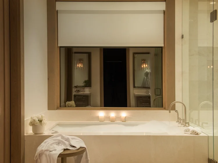 Bathroom with motorized shades: Lutron Sivoia QS shades and HomeWorks QSX lighting